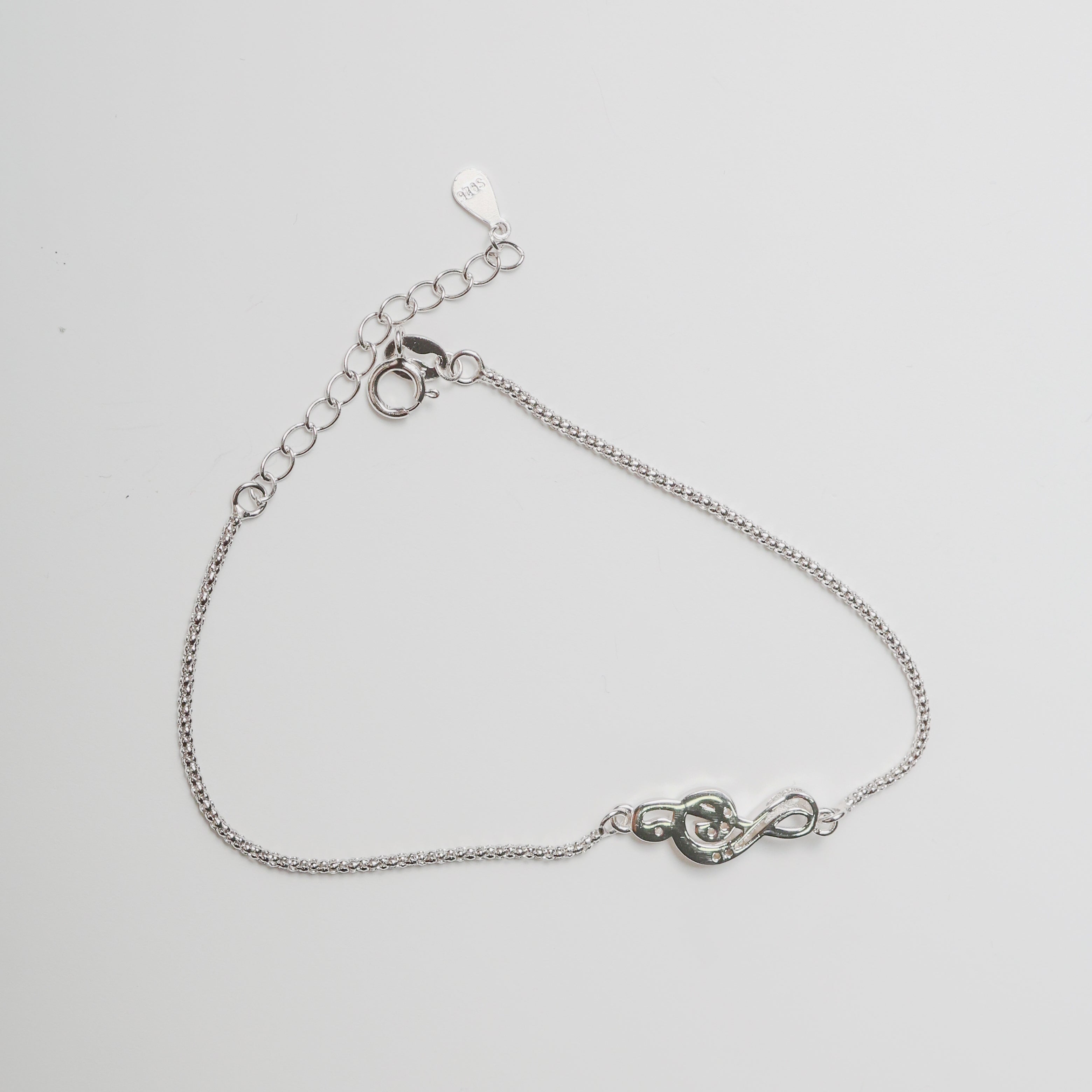 Bracciale nota musicale in argento con zirconi bianchi