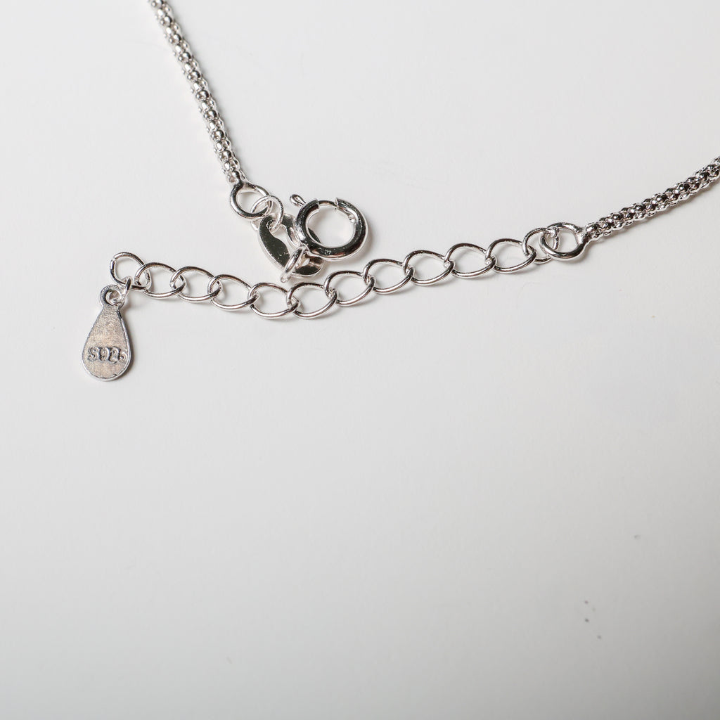 Bracciale nota musicale in argento con zirconi bianchi