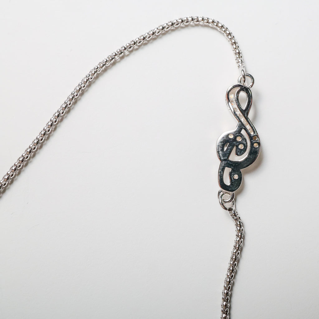 Bracciale nota musicale in argento con zirconi bianchi