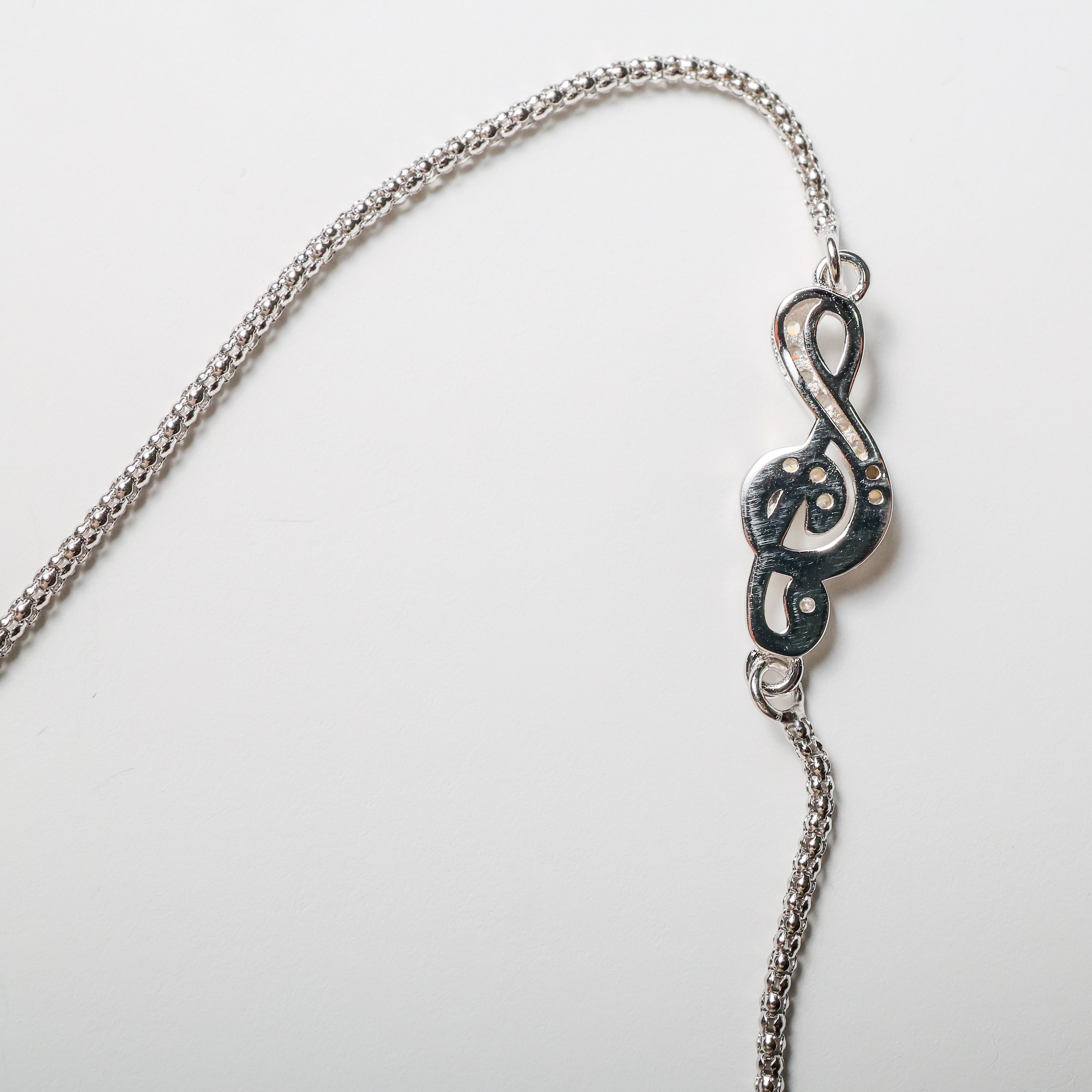 Bracciale nota musicale in argento con zirconi bianchi