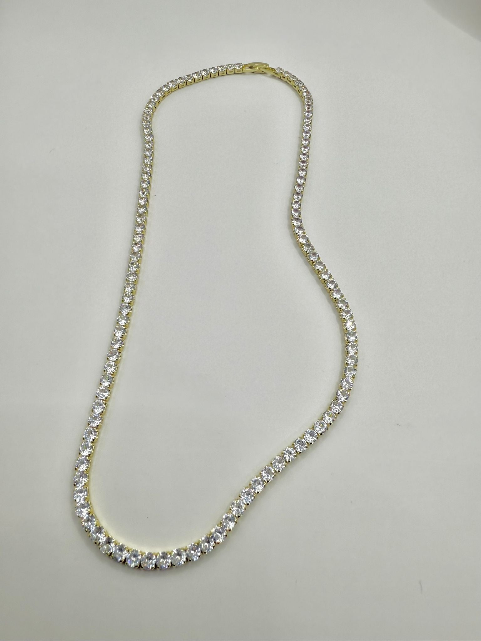 Collana tennis con montatura color oro